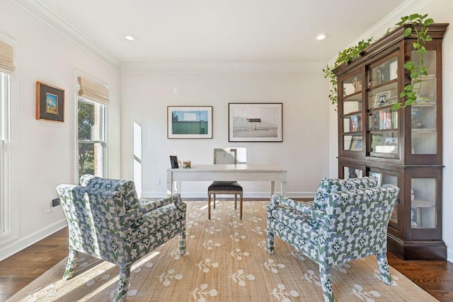 sitting room with crown molding and dark wood-type flooring