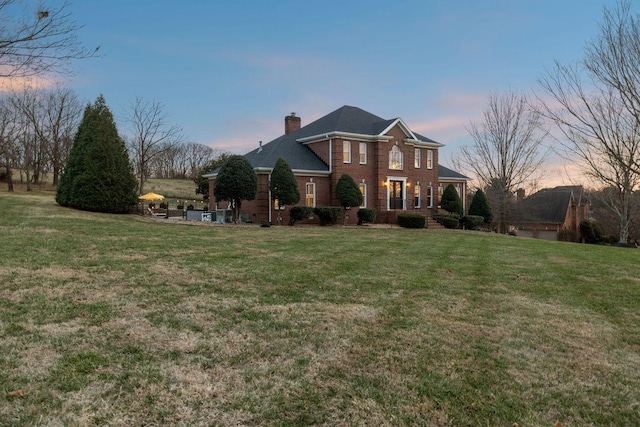 view of front of house with a yard