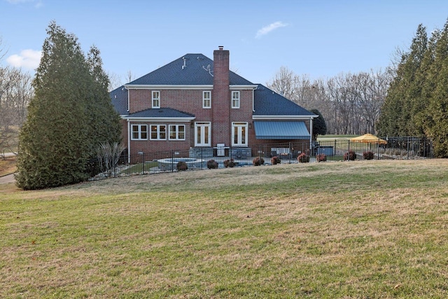 back of house featuring a lawn