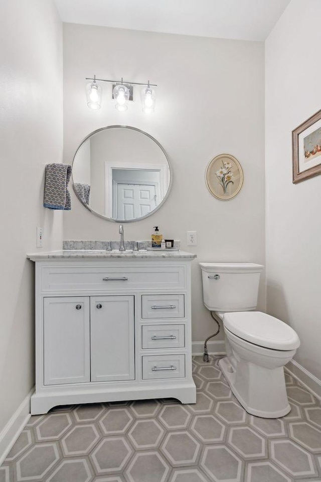 bathroom with vanity and toilet