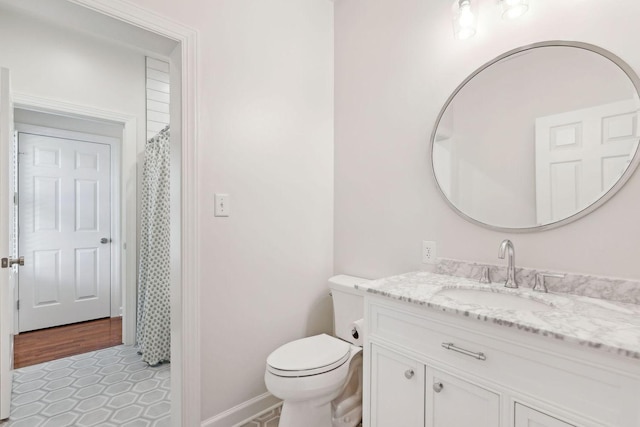 bathroom with vanity, tile patterned floors, toilet, and a shower with shower curtain