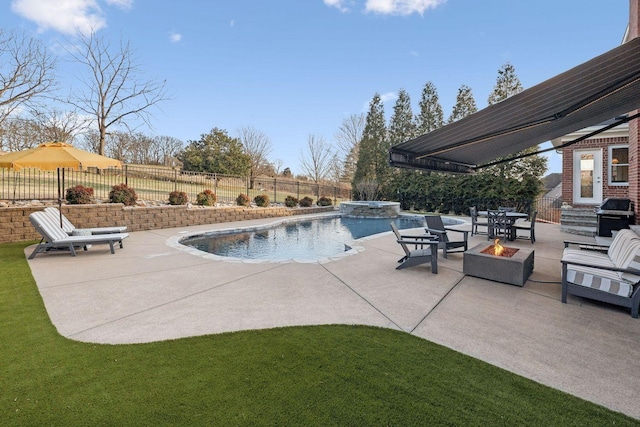 view of swimming pool featuring area for grilling, a fire pit, and a patio