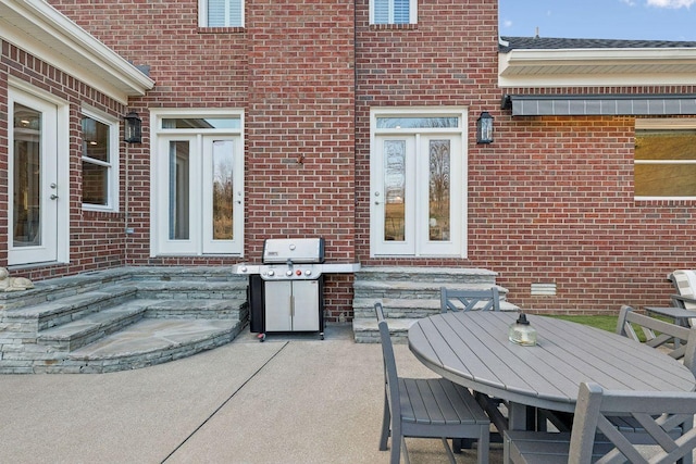 view of patio / terrace with area for grilling and french doors