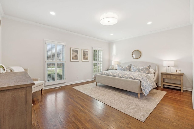 bedroom featuring dark wood-type flooring and ornamental molding