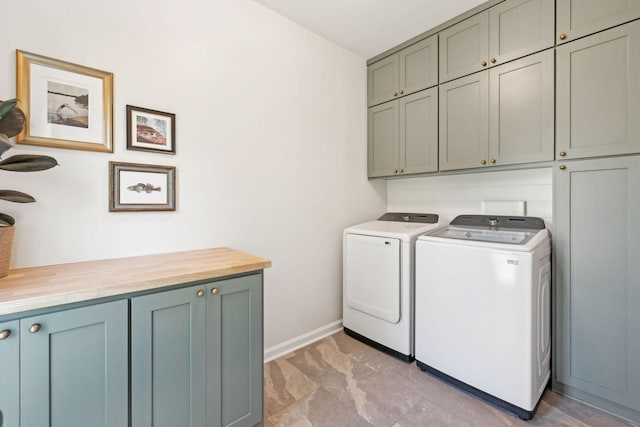 laundry room with cabinets and independent washer and dryer