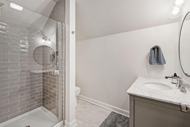 bathroom featuring vanity, lofted ceiling, walk in shower, and toilet