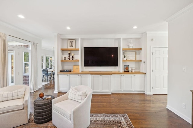 living room featuring crown molding and dark hardwood / wood-style flooring