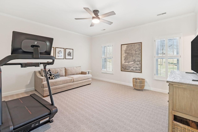 workout room featuring light carpet, crown molding, and ceiling fan