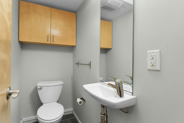 bathroom featuring tile patterned flooring, sink, and toilet