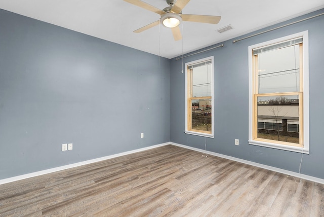 unfurnished room featuring ceiling fan and light hardwood / wood-style floors