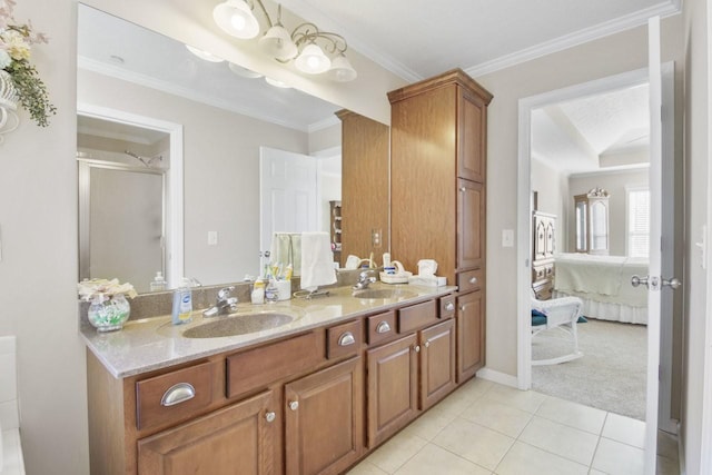 bathroom with a shower with door, ornamental molding, tile patterned floors, and vanity