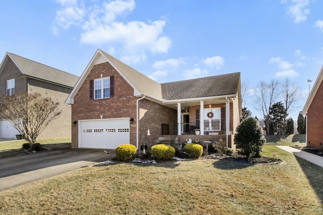 view of property featuring a garage, covered porch, and a front lawn