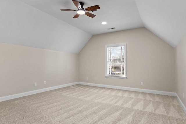 bonus room with vaulted ceiling, carpet floors, and ceiling fan