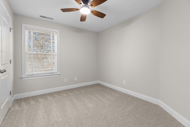 empty room with carpet floors and ceiling fan