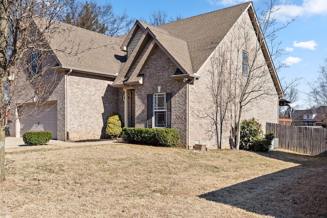 view of front facade with a garage and a front yard