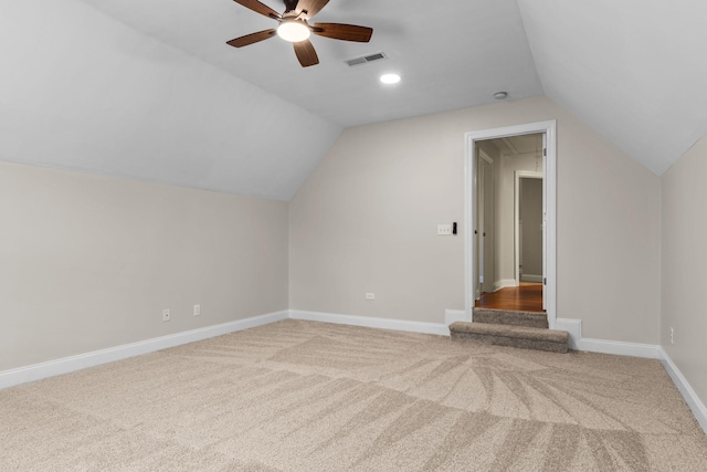 additional living space featuring lofted ceiling, carpet floors, and ceiling fan