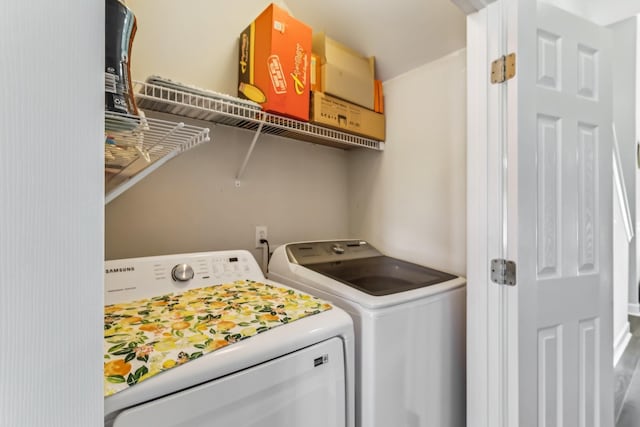 laundry area with separate washer and dryer