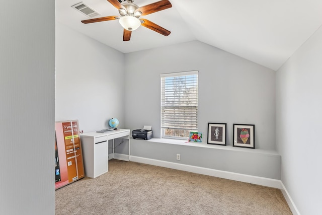 unfurnished office with ceiling fan, light colored carpet, and vaulted ceiling