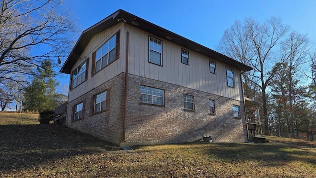 view of property exterior with a yard