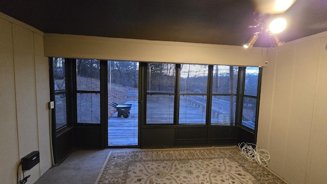 entryway featuring carpet flooring