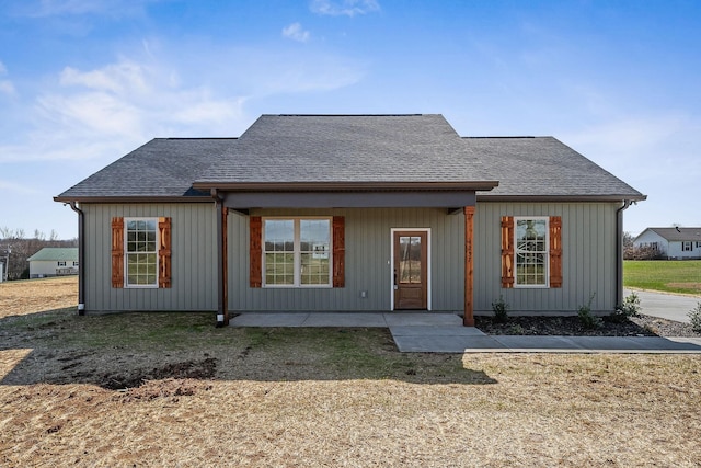 view of front facade with a patio and a front yard