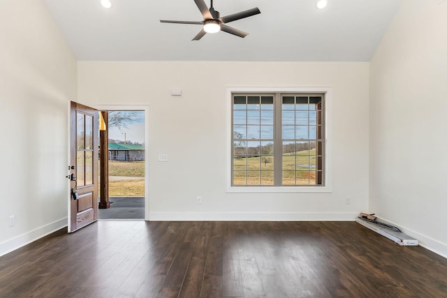 unfurnished room with ceiling fan and dark hardwood / wood-style floors