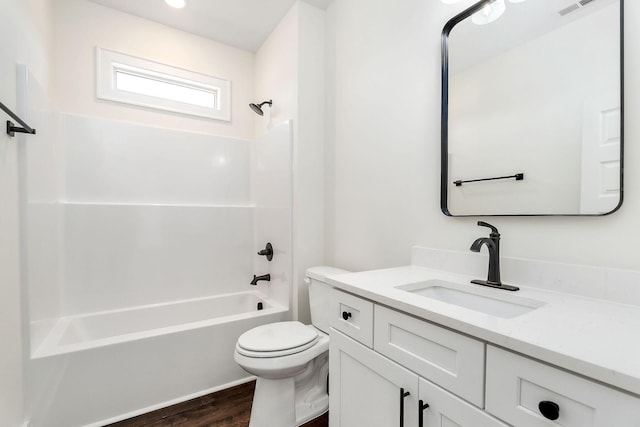 full bathroom with toilet, vanity, shower / washtub combination, and wood-type flooring