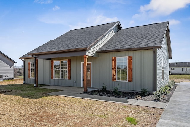 view of front of home featuring central AC unit and a front lawn