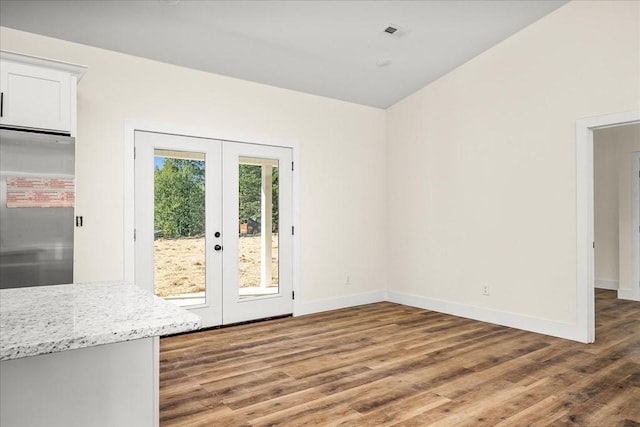 interior space with french doors and dark hardwood / wood-style floors