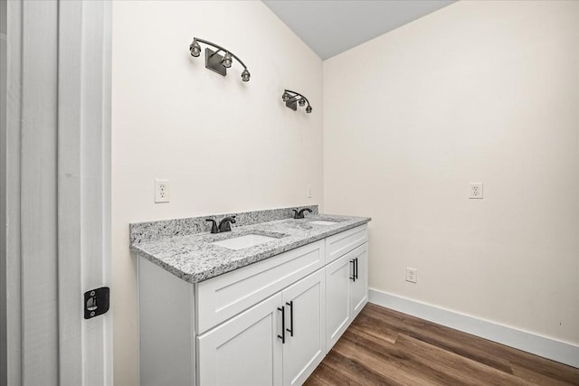 bathroom featuring vanity and wood-type flooring