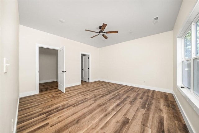 interior space with hardwood / wood-style floors, a closet, and ceiling fan