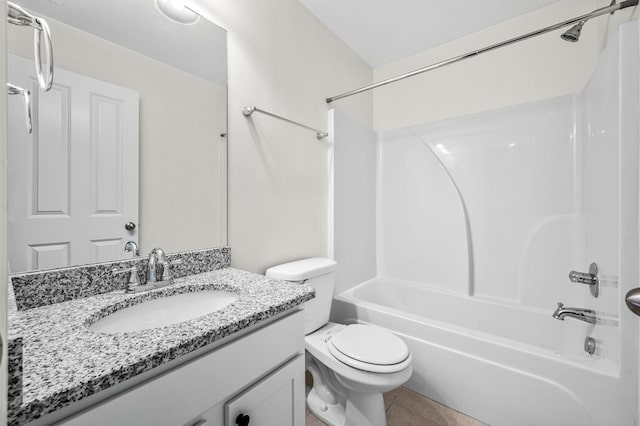 full bathroom with washtub / shower combination, vanity, toilet, and tile patterned flooring