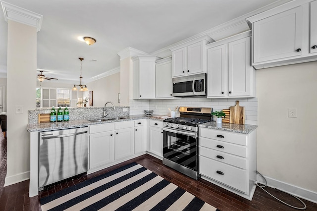 kitchen featuring stainless steel appliances, crown molding, sink, and white cabinets