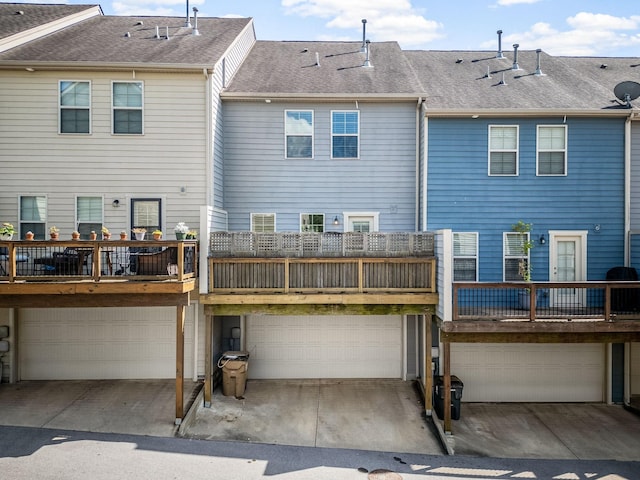 rear view of property with a garage