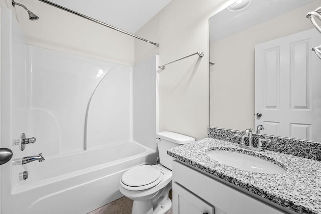 full bathroom with washtub / shower combination, vanity, toilet, and tile patterned floors