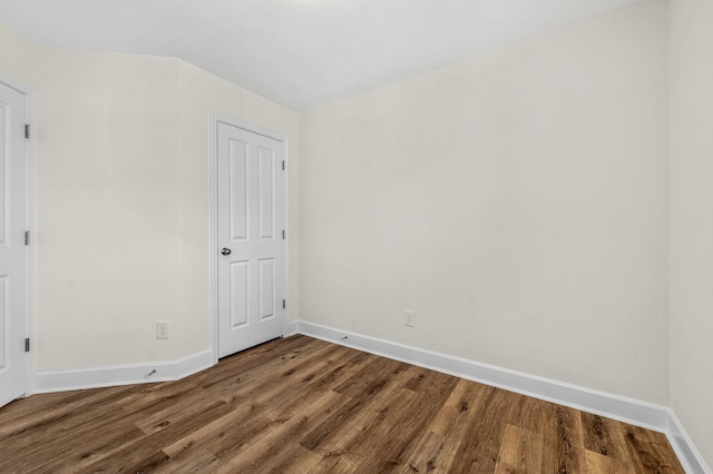 unfurnished room with wood-type flooring