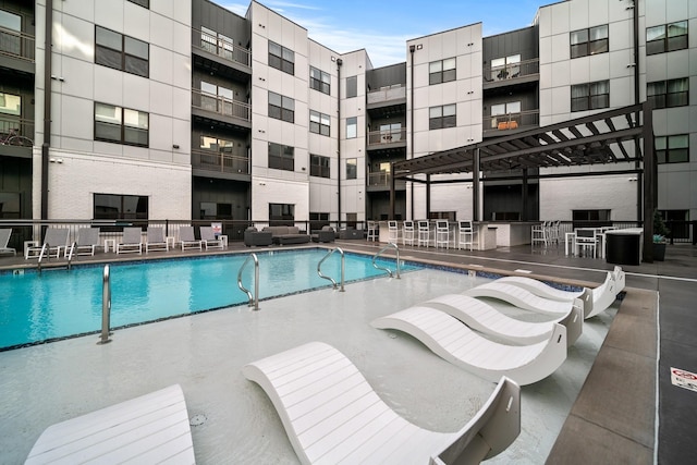 view of pool featuring a pergola and a patio area