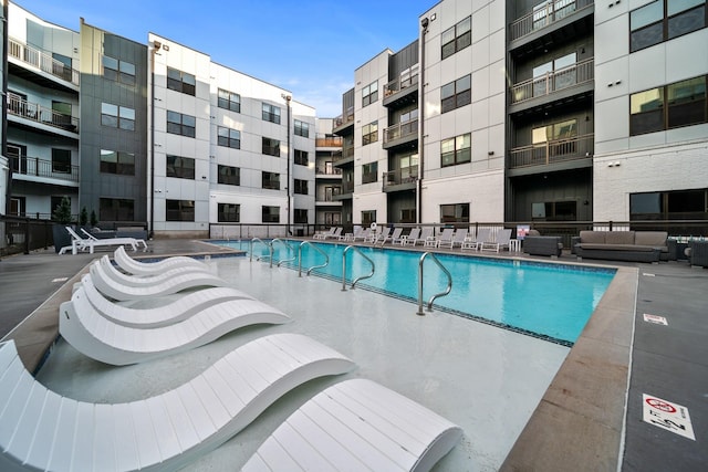 view of swimming pool featuring an outdoor hangout area and a patio area