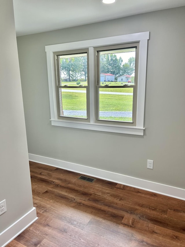 spare room featuring hardwood / wood-style flooring