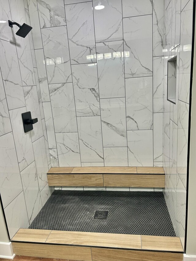 bathroom featuring tiled shower