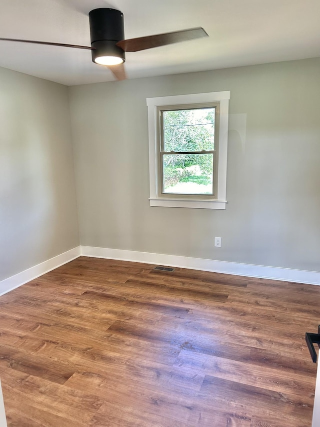 unfurnished room featuring ceiling fan and wood-type flooring