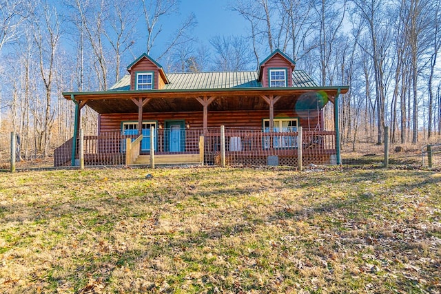 view of front of home featuring covered porch and a front lawn