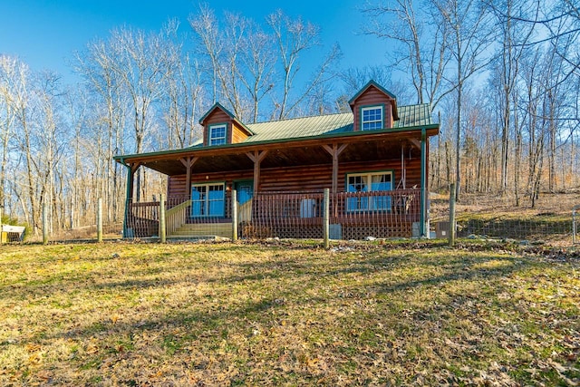 view of front of house featuring a front yard and covered porch