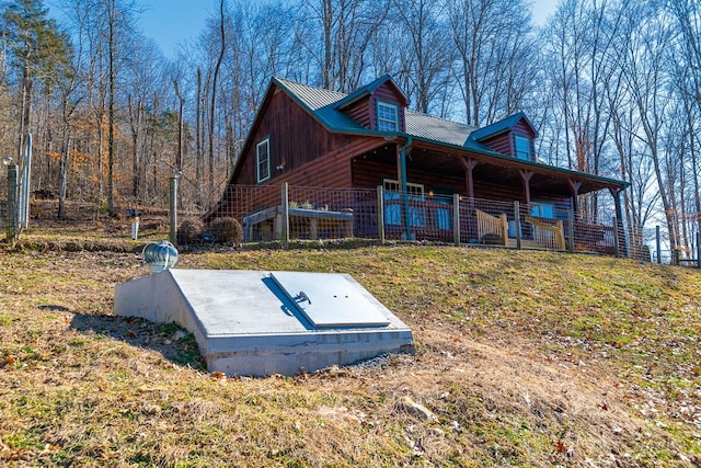 view of storm shelter with a yard