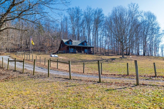 view of yard with a rural view