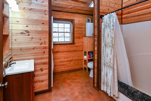 full bathroom with wooden ceiling, toilet, vanity, and wood walls