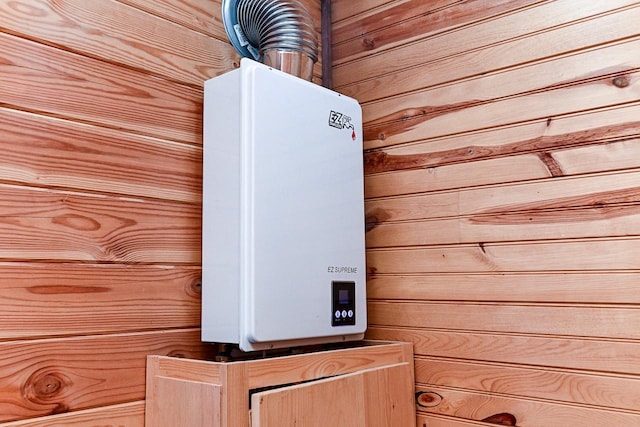 room details with tankless water heater and wood walls