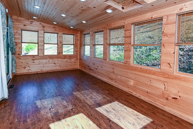 unfurnished sunroom featuring vaulted ceiling and wooden ceiling