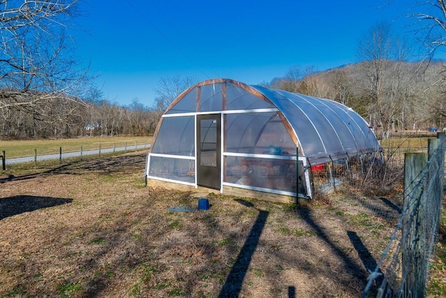 view of outbuilding featuring a rural view