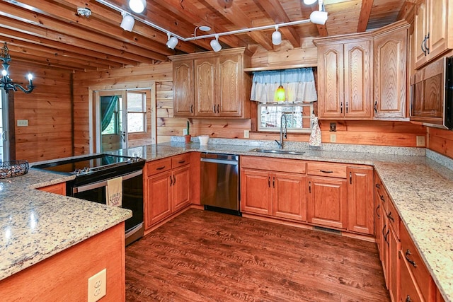 kitchen with sink, wood walls, wooden ceiling, appliances with stainless steel finishes, and dark hardwood / wood-style flooring